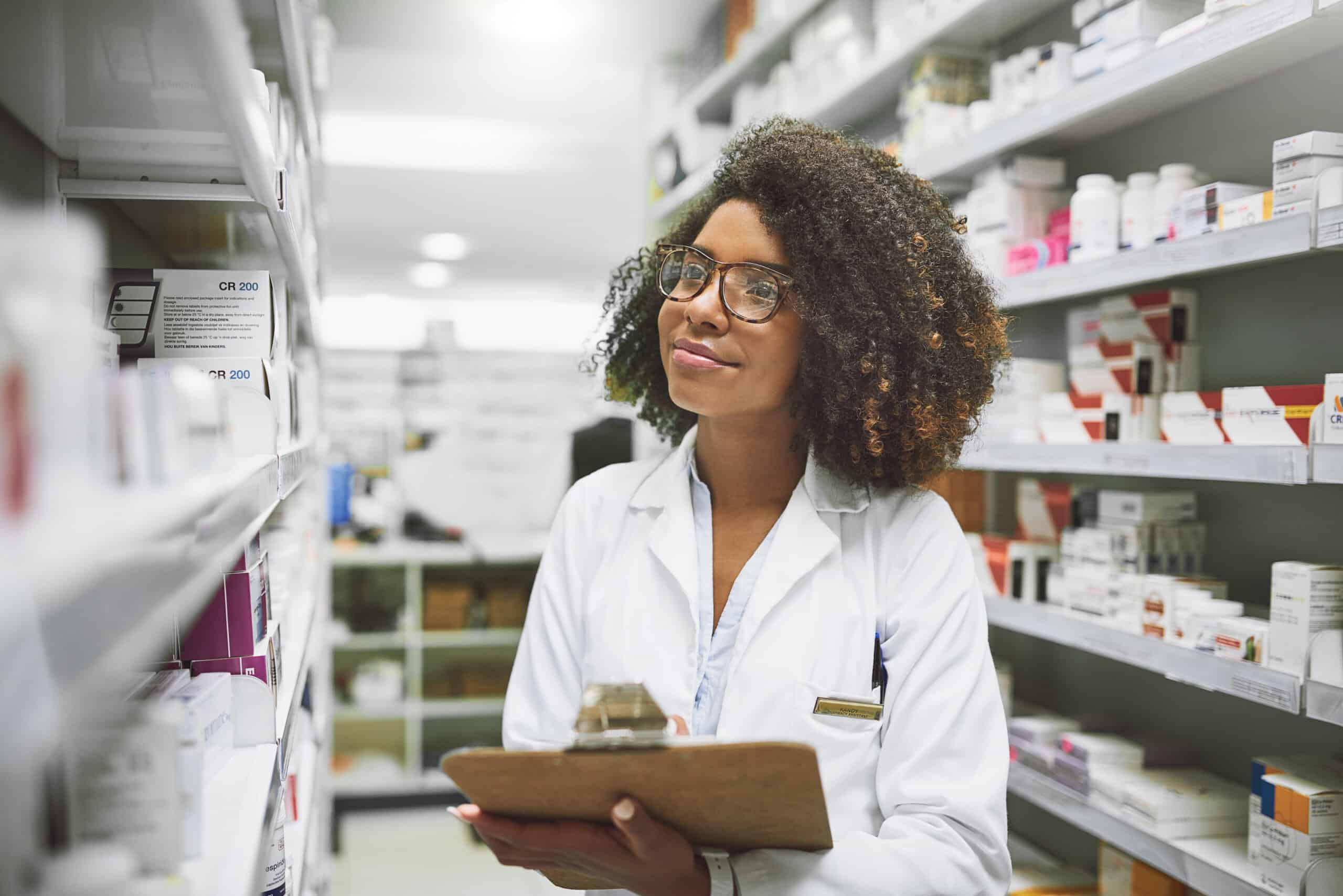 Medicine, shelf and woman with clipboard in pharmacy for pharmaceutical, storage and information. Pills, inspection and pharmacist with checklist for healthcare, product and review of medical stock.